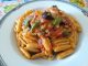 Maloreddus con ragù, olive nere e pesto.